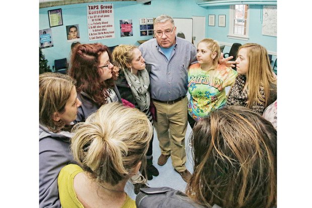 John Shinholser, who is celebrating 33 years free of drug use, conducts a recovery meeting Tuesday at the McShin Foundation, a nonprofit he leads at 2300 Dumbarton Road.