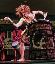 Marking Kwanzaa //
Casy Jones with the Elegba Folklore Society, left, provides a rhythmic beat of drums Saturday to mark the celebration of the 29th Annual Capital City Kwanzaa Festival at the Altria Theater.