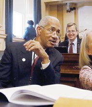 Joseph D. “Joe” Morrissey, left, wearing an ankle bracelet on daytime release
from jail, is given the cold shoulder by fellow politicians on his first day back in
the House of Delegates in January after winning a special election for the seat he resigned from following his conviction in a sex scandal. His seatmates, Delegates Joseph E. Preston of Petersburg and Kathleen Murphy of Loudoun County, celebrate their first day at the General Assembly session with selfies.