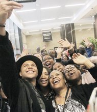 Richmond native Rayvon Owen takes a selfie with throngs of cheering fans at Richmond City Hall before his hometown performance as an “American Idol” Top 4 finalist in May at the James Center.