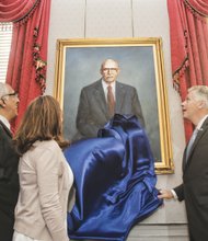 A portrait of the late civil rights giant Oliver W. Hill is unveiled in Virginia’s Executive Mansion in June by Gov. Terry McAuliffe, right, his wife, Dorothy McAuliffe, and Mr. Hill’s son, Oliver W. Hill Jr. The painting is one of the first of an African-American to be showcased in the house where Virginia governors have lived since 1813.