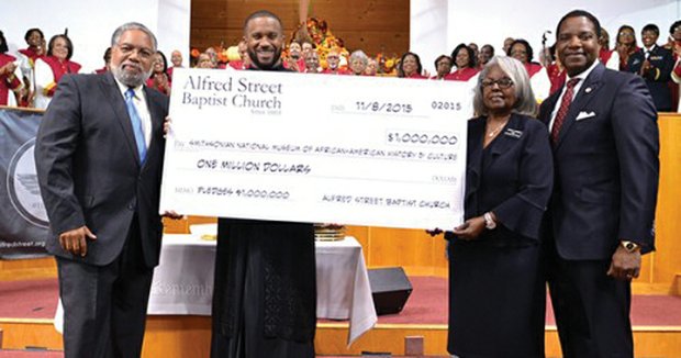 Celebrating Alfred Street Baptist Church’s $1 million donation, from left, Lonnie Bunch, founding director of the Smithsonian’s National Museum of African American History and Culture; the Rev. Howard-John Wesley, church pastor; Pat Johnson, chair of the church deacon board; and James L. McNeil, chairman of the church’s board of trustees.
