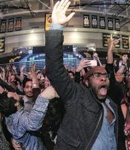 Ringing in the New Year // Brian Richardson and Jasmine Valentine cheer with hundreds of others inside Virginia Commonwealth University’s Siegel Center as a new year rolls in last Thursday. 