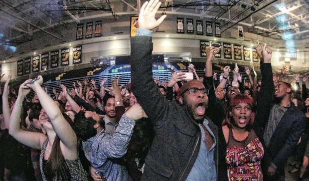 Ringing in the New Year // Brian Richardson and Jasmine Valentine cheer with hundreds of others inside Virginia Commonwealth University’s Siegel Center as a new year rolls in last Thursday. 