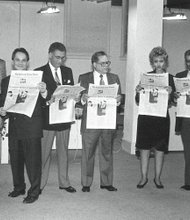 Celebrating 24 years // Checking out the Free Press //

Clinton A. Strane/Richmond Free Press
Officers and members of the board of directors of Paradigm Communications Inc., the parent company of the Richmond Free Press, check out a prototype of the new newspaper in its newsroom located in Downtown. From left, the late Dr. Allix B. James, Dr. Elwood Boone Jr.; the late Free Press founder Raymond H. Boone Sr., president and CEO; the late Dr. Darrel Rollins, board secretary; the late Dr. William S. Thornton, board chairman; Beverly Davis; the late Leonard Lambert, board treasurer; Dr. Lerla Joseph; and Clarence L. Townes Jr. This photograph was published on the front page of the Free Press debut edition Jan. 16-18, 1992.
