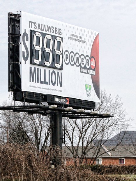 Slices of life and scenes in Richmond //
This billboard is overwhelmed by the historic size of the Powerball jackpot ahead of Wednesday’s drawing. The sign shows the jackpot at $999 million because there are not enough number slots to show the full amount, about $1.5 billion. Location: the 1300 block of Dinneen Street on North Side. Millions of hopefuls purchased tickets this week for the chance of being struck by luck and becoming a billionaire. The chances of winning are 1 in 292 million.