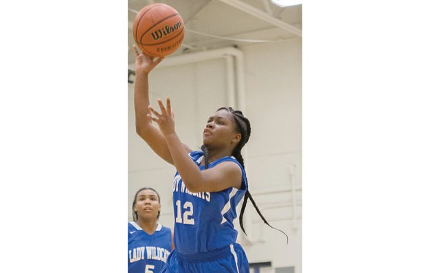 Armstrong High School starting guard Rashaundra Thomas shoots for the hoop during a recent practice. With her shooting skills, Thomas and the team hope to head to the 3A state tournament.