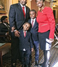 Lady of the House //
Freshman Delegate Lashrecse Aird enjoys a moment
with her family on the opening day of the 2016 Virginia General Assembly session. With her Wednesday are her proud husband, Blaine Aird, and their children, Blake,
left, and Blaine Jr. The Petersburg Democrat was sworn
in Wednesday to her first term in the House. Elected in November, she represents the 63rd House District, which also includes parts of Hopewell and Chesterfield and Dinwiddie and Prince George counties. State lawmakers will meet at the Capitol through mid-March to grapple with major issues, including a new two-year state budget.