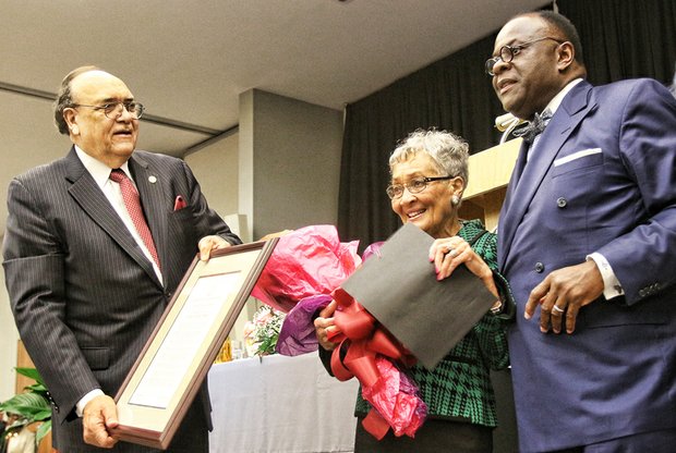 Virginia Union University President Claude G. Perkins, left, and Dr. W. Franklyn Richardson, chairman of the VUU Board of Trustees, present the MLK Lifetime of Service Award to VUU alumna Florence Neal Cooper Smith of Richmond for her work on sickle cell anemia testing and awareness in Virginia and across the nation.