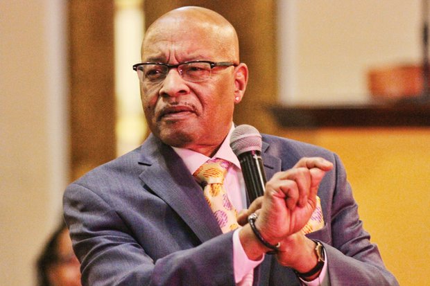 The Rev. Leonidas B. Young II speaks to his congregation at New Kingdom Christian Ministries on North Side in December 2014. 
