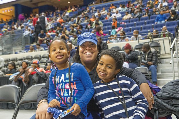 Family of fans //
Katrina Cheatham and her children, Camryn, 3, and Patrick, 5, enjoy the Freedom Classic basketball game last Sunday that pit Virginia Union University against rival Virginia State University at the Richmond Coliseum. 
