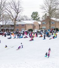 Winter fun, work // Winter adventure lovers turned out to sled down the snow-covered hills at Forest Hill Park on Monday after a foot or more of snow blanketed the Richmond area last weekend, bringing life in the region to a near standstill. 