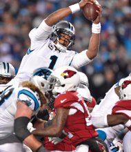 
Carolina Panthers quarterback Cam Newton dives for a touchdown during the Jan. 24 NFC championship game against the Arizona Cardinals in Charlotte, N.C.