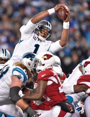
Carolina Panthers quarterback Cam Newton dives for a touchdown during the Jan. 24 NFC championship game against the Arizona Cardinals in Charlotte, N.C.