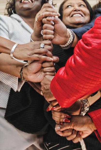 Let Freedom Ring! //  A group of women join togeather to ring the bell at First Baptist Church, one of the nation’s oldest African-American churches.
