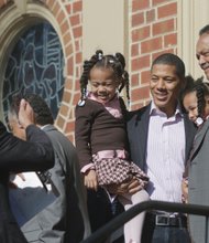 Let freedom ring! //  After the ceremony, Rev. Jackson poses for a photograph with Shannon Lanier, center, and his daughters, Madison and McKenzie, who are Jefferson-Hemings descendents. 

