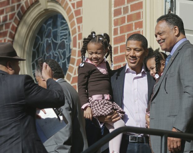 Let freedom ring! //  After the ceremony, Rev. Jackson poses for a photograph with Shannon Lanier, center, and his daughters, Madison and McKenzie, who are Jefferson-Hemings descendents. 

