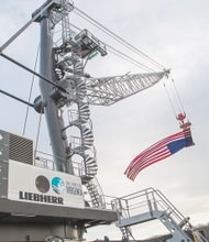 Cityscape // This new 124-ton crane stands tall at the Richmond Marine Terminal, making it easier to load and unload cargo from ships docked at the James River port off Commerce Road in South Side. The crane, which reaches about 24 stories, cost $4.2 million and is part of the $17 million being invested in the port by the Virginia Port Authority, the independent agency leasing and operating the city’s port for the next 40 years. 