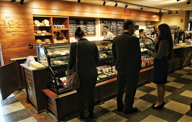 Café and bakery debuts at theater // Customers browse at the new 1927 Café and Bakery inside the Altria Theater at Main and Laurel streets across from Monroe Park. The shop opened last week and offers breakfast, lunch and evening bistro fare, along with teas and coffee. The café is open seven days a week to the public and provides additional food and beverage options for show attendees. The name pays tribute to the year when a Masonic group opened the building as The Mosque.