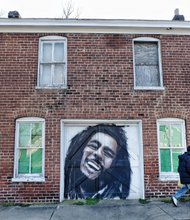 Cityscape // Slices of life and scenes in Richmond
A pedestrian passes this tribute to the late great reggae master Bob Marley. Perhaps this homeowner was inspired to add some garage door art by all of the large murals popping up in Richmond. Location: 13th Street between Bainbridge and Porter streets in South Side.