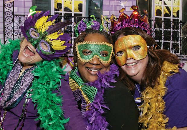 From left, Anne Gyer, Delly Evans and Mardi Bras founder Marti Williams party as they do good — collecting essential items for homeless women. Location: Atlee Community Church’s Northminster Campus on North Side. Right, some of the items that supporters of Mardi Bras contributed, including bras and feminine hygiene products. 