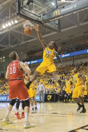 
Virginia Commonwealth University forward Mo Alie-Cox emphatically slams home two of his 12 points in the Rams’ 87-74 win last Friday over the University of Richmond Spiders at the Siegel Center. 