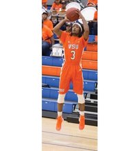Virginia State University’s Kevin Williams, who leads the Trojans in scoring and assists, fires off a jump shot in a recent game.