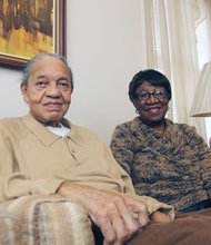 William and Ora Lomax, relax at home as they prepare to launch a combination barber-beauty shop on South Side. 
