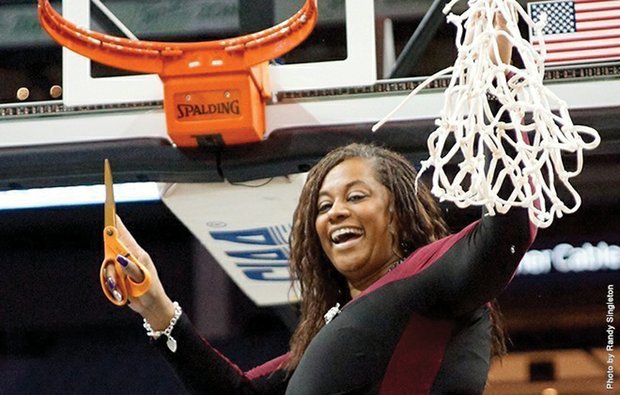 
Coach AnnMarie Gilbert of the Virginia Union University Lady Panthers celebrates the team’s CIAA championship last Saturday by making the final cut to take home the victory net in Charlotte, N.C.