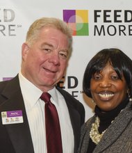 Zestful celebration // FeedMore CEO Doug Pick talks with key- note speaker Cheryl Maroney, director of A Child Is Born Learning Center in Henrico County.