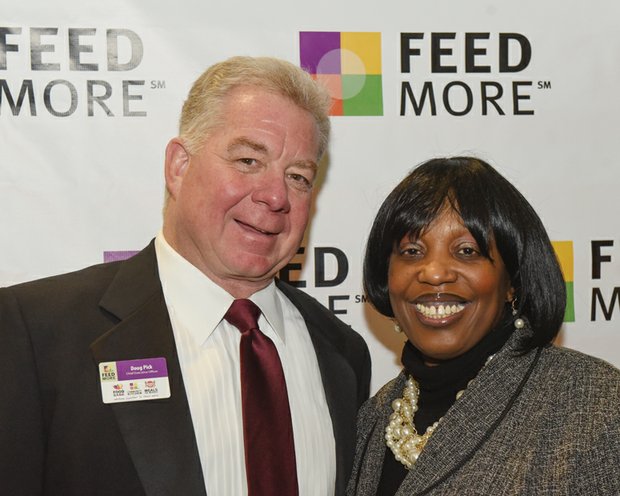 Zestful celebration // FeedMore CEO Doug Pick talks with key- note speaker Cheryl Maroney, director of A Child Is Born Learning Center in Henrico County.