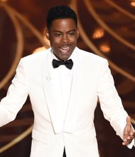 Chris Rock keeps the audience laughing at the Oscars on Sunday at the Dolby Theatre in Los Angeles.