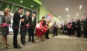 Gov. Terry McAuliffe, third from left, cuts the ribbon at the grand opening ceremony Wednesday. Joining him, from left, Leslie Wyatt, executive director of the Children’s Hospital; VCU President Michael Rao; John DuVal, CEO of VCU Health Systems; Brianna Burke and her mother, Nicole Hauser; and Maggie Raph holding her son, Carter.