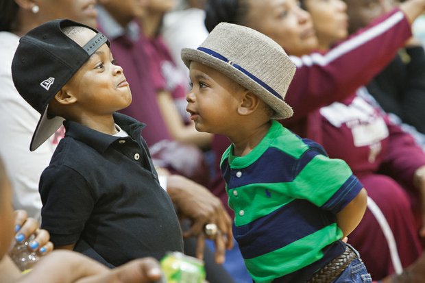 Talkin’ that talk //
Basketball fans come in all ages, as the Virginia Union University Lady Panthers experienced during their recent NCAA Division II games at Barco-Stevens Hall. Here, Christian Prince, left, and his buddy Knight Jones, dissect the latest play last Friday night, when the Lady Panthers took on Indiana University of Pennsylvania. VUU rolled to a 91-72 win to advance to last Saturday’s regional semifinals. 