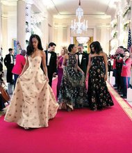 Malia and Sasha Obama turned the Cross Hall portico into a fashion catwalk — making a splash in designer gowns at their first state dinner. The First Family welcomed Prime Minister Justin Trudeau and his wife, Sophie Grégoire Trudeau, to the White House. It was the first U.S. visit for a Canadian prime minister in nearly two decades. 