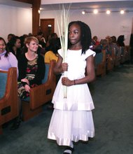 Palm Sunday // Christians across the globe celebrated Palm Sunday this week, with the palms representing the branches scattered in front of Jesus during his triumphant entry into Jerusalem about a week before his ultimate crucifixion and Resurrection. At Westwood Baptist Church in Richmond’s West End, Jayla Watkins, above, carry palms to distribute to the congregation at the church on Glen Burnie Road. 