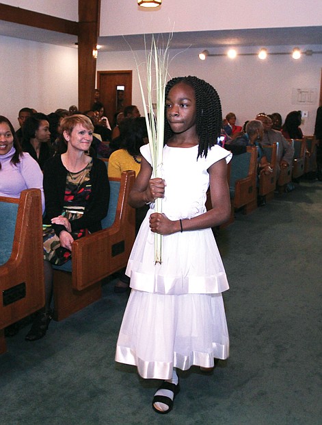 Palm Sunday // Christians across the globe celebrated Palm Sunday this week, with the palms representing the branches scattered in front of Jesus during his triumphant entry into Jerusalem about a week before his ultimate crucifixion and Resurrection. At Westwood Baptist Church in Richmond’s West End, Jayla Watkins, above, carry palms to distribute to the congregation at the church on Glen Burnie Road. 