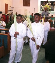 Christians across the globe celebrated Palm Sunday this week, with the palms representing the branches scattered in front of Jesus during his triumphant entry into Jerusalem about a week before his ultimate crucifixion and Resurrection. At Westwood Baptist Church in Richmond’s West End, John Cunningham Jr, left, and Justice Thompson, carry palms to distribute to the congregation at the church on Glen Burnie Road. 