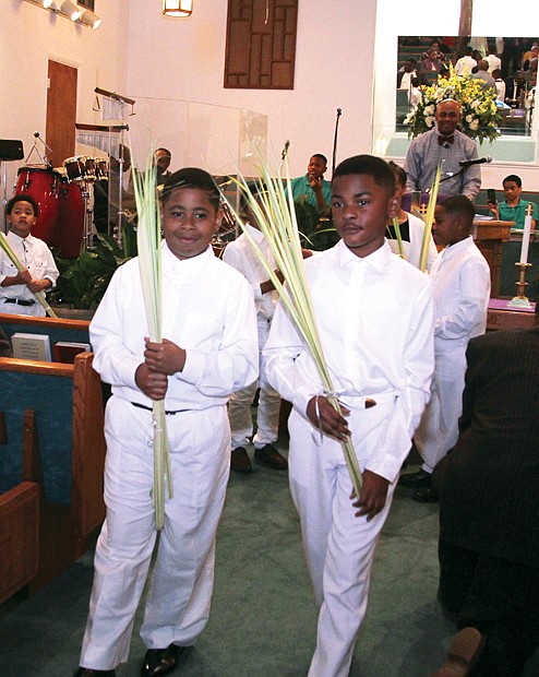 Christians across the globe celebrated Palm Sunday this week, with the palms representing the branches scattered in front of Jesus during his triumphant entry into Jerusalem about a week before his ultimate crucifixion and Resurrection. At Westwood Baptist Church in Richmond’s West End, John Cunningham Jr, left, and Justice Thompson, carry palms to distribute to the congregation at the church on Glen Burnie Road. 