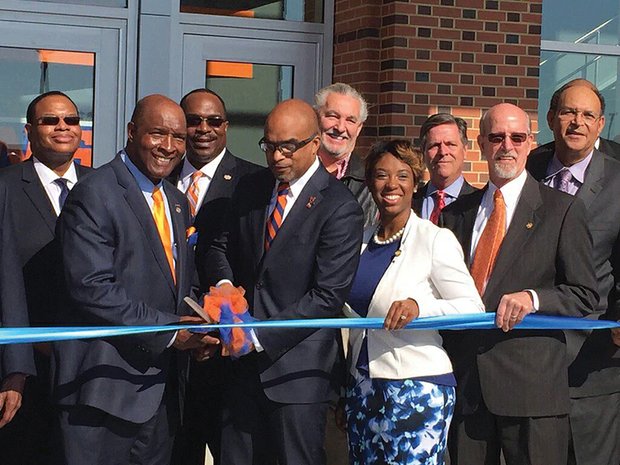 Official opening at VSU // Virginia State University officials and special guests help to cut the ribbon on the new $84 million VSU Multipurpose Center on campus that will host university and community events. The official ribbon cutting coincided with the university’s 134th Founders’ Day convocation, with retired Brig. Gen. Sheila Baxter, a 1977 VSU alumna, giving the keynote address. The event also observed the 100th anniversary of the Reserve Officers’ Training Corps, or ROTC. Brig. Gen. Baxter, who initially was commissioned in 1978 through the ROTC, was the first African-American female to be promoted to brigadier general in the Army Medical Service Corps in 2003. Participating in the ribbon cutting are, from left, VSU Vice Rector Willie Randall, VSU President Makola Abdullah, Delegate Lashrecse Aird, Chesterfield Board of Supervisors Chairman Steve Elswick and Chesterfield’s Dale District Supervisor James Holland.