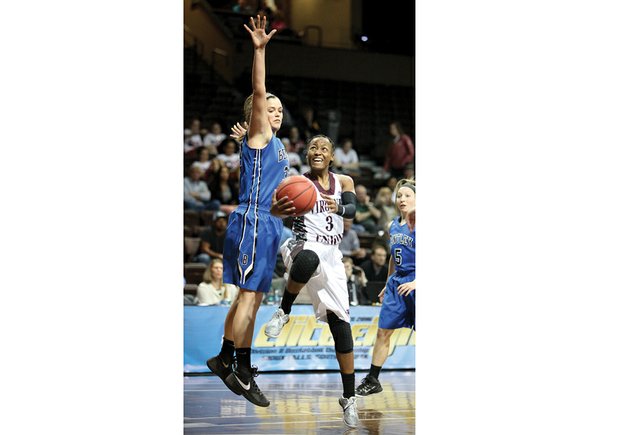 Virginia Union University star Kiana Johnson drives to the basket against Bentley University’s Jen Gemma during Tuesday’s heart-wrenching 53-52 loss by the Lady Panthers in the NCAA Women’s Division II Elite Eight in Sioux Falls, S.D.