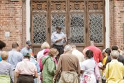 The Rev. Paul A. Coles, pastor of Sharon Baptist Church, leads a reading from the Easter story outside Centenary United Methodist Church on Grace Street, one of the stops on the Stations of the Cross walk last Friday.
