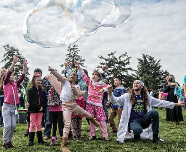 Easter events in the city // Aaris Moore, 5, center, and other wide-eyed children reach up to try and touch a giant bubble last Saturday at Maymont’s Dominion Family Easter celebration. The family friendly event featured an Easter egg hunt, bonnet making and parade and storytelling. 