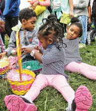 Easter egg-citement // The Cockrell siblings, Victoria, 2, front, Jermiah, 5, and Moriah, 4, rest in the grass with their Easter baskets Saturday at Maymont’s Dominion Family Easter. Hundreds of people of all ages enjoyed a variety of activities at the park in Richmond’s West End during the annual event. 