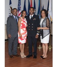 Ensign Justin Roberts of Richmond, second from right, is joined by his family after receiving his wings at a recent ceremony in Texas. From left, his father, Roscoe Roberts, wife 2nd Lt. Jazmind Roberts, and mother Judge Angela Roberts.