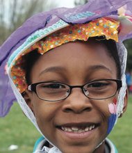 Easter events in the city //Destini Spain shows off the colorful bonnet she crafted alongside scores of other youngsters.