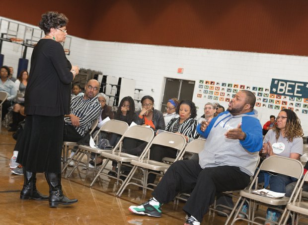 What about  the children? //
The Rev. Darrell Taylor, right, expresses his concerns Tuesday to City Councilwoman Ellen F. Robertson, 6th District, about plans to close Overby-Sheppard Elementary School to save money. The North Side school is among five schools targeted for closure if the city fails to provide additional money in the Richmond Public Schools’ budget. Ms. Robertson sponsored the public meeting with School Board member Shonda Harris-Muhammed. Both represent the North Side district. A community rally against closing Armstrong High School is set for 6 p.m. Thursday, April 14, at Mount Olivet Church, 1223 N. 25th St.
