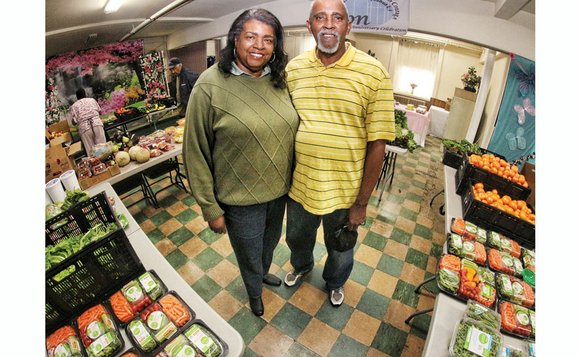 Boxes of tomatoes, peppers and other fruits and vegetables fill four tables in the basement social hall at Zion Baptist ...