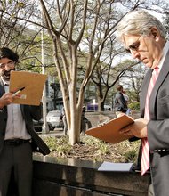 This is becoming a familiar sight across Richmond — candidates for public office collecting signatures from registered voters on petitions. Here, three mayoral candidates help each other by signing each other’s petitions Monday outside City Hall. From left, they are activist Alan Schintzius, teacher Chad Ingold and architect Bruce Tyler. To get on the ballot, each must collect 500 signatures, with at least 50 from each of the city’s nine City Council districts. 