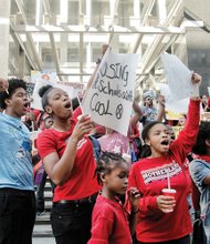 More than 500 people rally outside City Hall in support of Richmond schools funding.